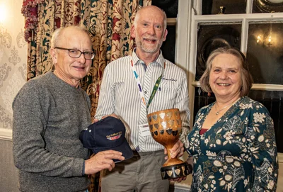 Jonathan Woodrow (centre) presents the Egg Cup Trophy to Louise and Richard Laudy, 5th April 2025